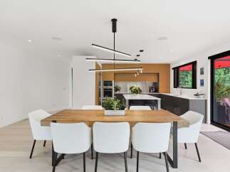 Experience modern living in this stunning open-concept dining and kitchen area.