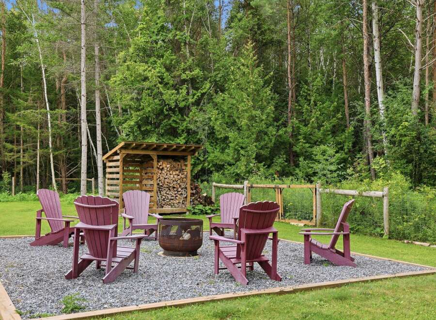 Enjoy the outdoors with this charming fire pit area, perfect for gathering with friends and family.