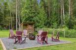 Enjoy the outdoors with this charming fire pit area, perfect for gathering with friends and family.