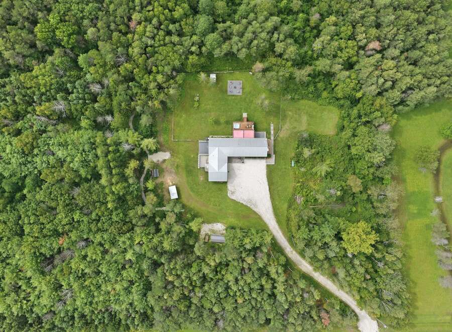 Discover this secluded property nestled amongst lush greenery, offering a private retreat.
