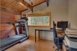 This room offers a perfect blend of fitness and productivity, featuring a NordicTrack treadmill for your workouts and a dedicated workspace with a computer and printer.