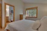This charming bedroom offers a cozy retreat with a comfortable bed and a convenient en-suite bathroom.