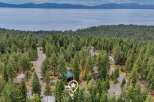 Nestled amidst a dense forest with a stunning lake view, this property offers a serene retreat.