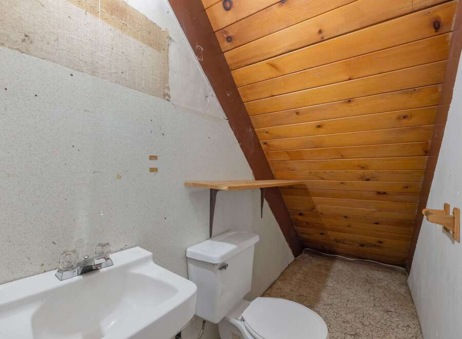 Discover this charming bathroom featuring a functional sink and toilet, perfect for any home.