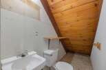 Discover this charming bathroom featuring a functional sink and toilet, perfect for any home.
