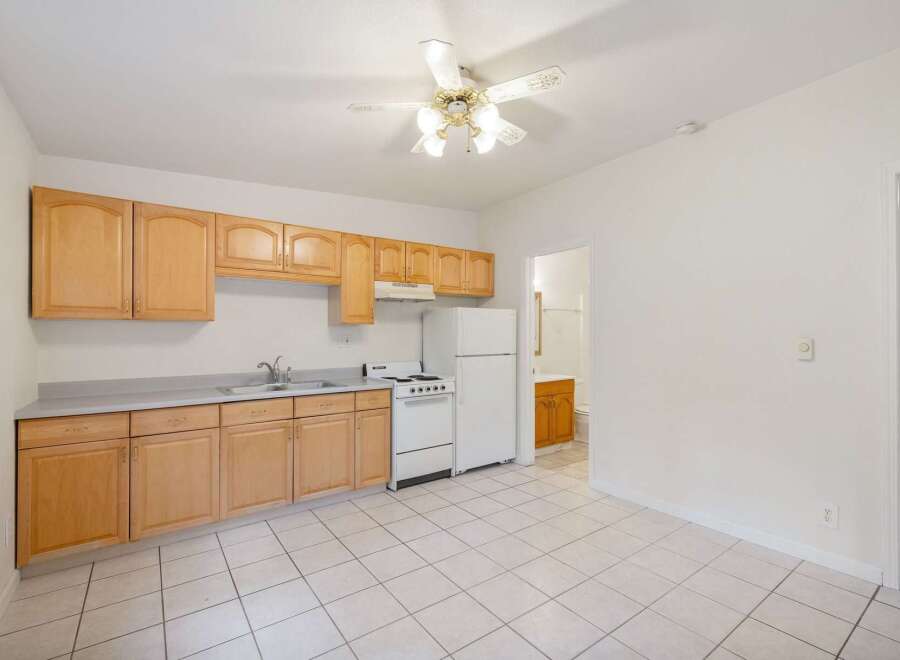 Discover this charming kitchen featuring light wood cabinetry and a practical layout.
