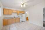 Discover this charming kitchen featuring light wood cabinetry and a practical layout.
