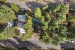 Discover this charming property nestled among mature pine trees, offering a serene and private setting.