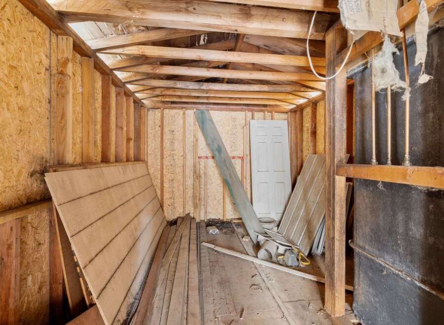 This unfinished interior space offers a blank canvas for your renovation dreams.