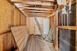 This unfinished interior space offers a blank canvas for your renovation dreams.
