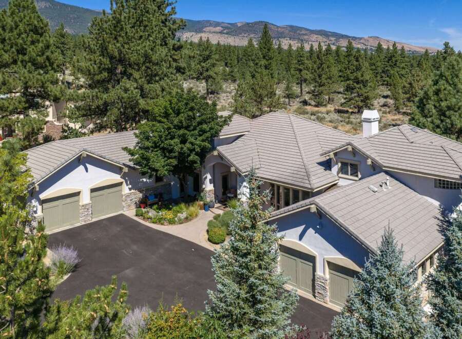 Experience luxury living in this stunning mountain estate, nestled amidst a serene pine forest.