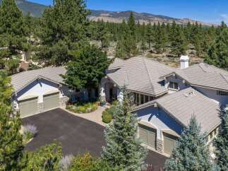 Experience luxury living in this stunning mountain estate, nestled amidst a serene pine forest.