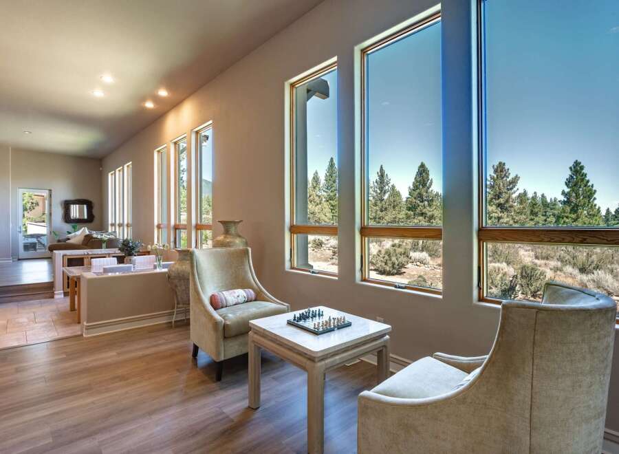 Experience breathtaking mountain views from this stunning living area, featuring expansive windows that flood the space with natural light.
