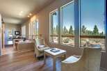 Experience breathtaking mountain views from this stunning living area, featuring expansive windows that flood the space with natural light.