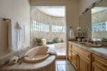 Indulge in luxury with this stunning bathroom featuring a spacious, built-in bathtub perfect for relaxation.