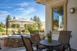 Enjoy outdoor living at its finest with this stunning patio featuring a luxurious stone-encased hot tub perfect for relaxation.