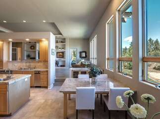Experience breathtaking views from this stunning home, featuring a spacious open-concept kitchen and dining area perfect for entertaining.
