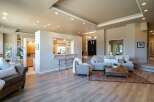 Experience open-concept living in this stunning home, seamlessly blending a modern kitchen with a spacious living area.