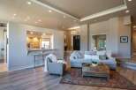 Experience open-concept living in this beautifully appointed home, featuring a seamless flow between the living area and a modern kitchen with a convenient breakfast bar.
