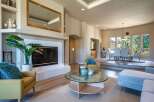 Experience elegant living in this spacious home featuring a grand fireplace and a formal dining area perfect for entertaining.