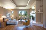 Experience luxurious living in this stunning living room, featuring a spacious sectional sofa and comfortable accent chairs perfect for relaxation.
