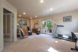 Discover versatile living in this spacious room, perfect for relaxation and fitness.