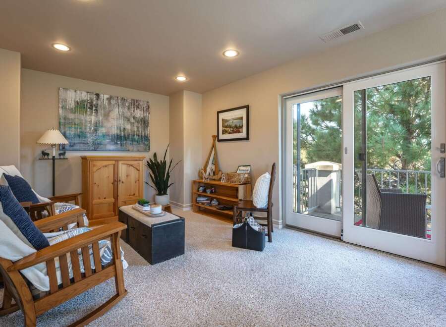 Step into this inviting living space featuring comfortable rocking chairs perfect for relaxation.