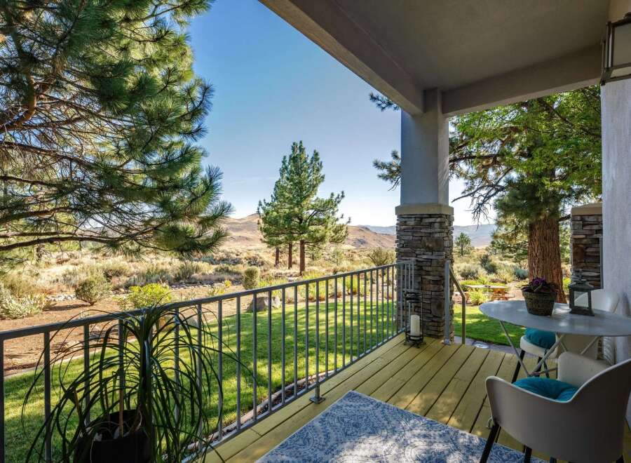 Enjoy breathtaking mountain views from this charming covered porch, perfect for morning coffee or evening relaxation.
