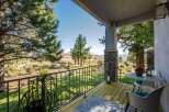 Enjoy breathtaking mountain views from this charming covered porch, perfect for morning coffee or evening relaxation.