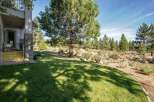 Enjoy the serene mountain landscape from this property, featuring a well-maintained lawn perfect for outdoor activities.