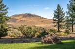 Discover a serene landscape with a majestic mountain backdrop, perfect for a tranquil retreat.