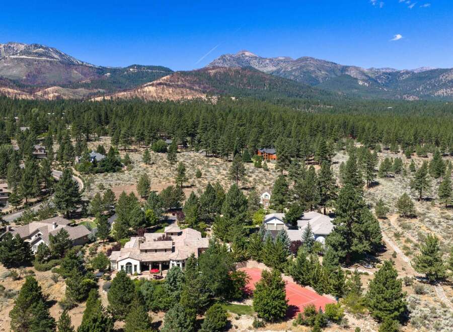 Nestled amidst a lush pine forest with stunning mountain views, this expansive estate offers unparalleled privacy and luxury.