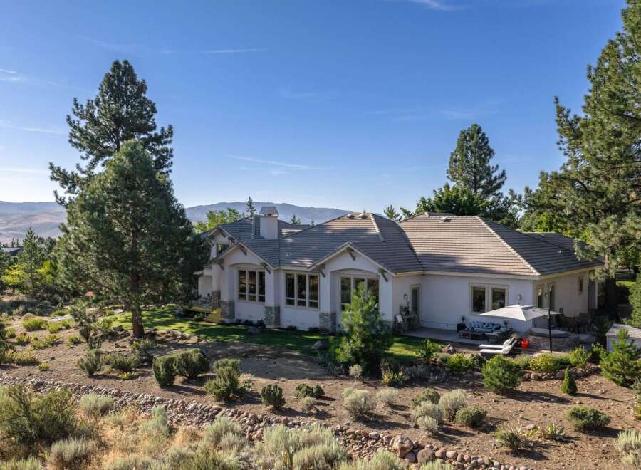 Discover this stunning single-story home nestled in a serene, natural landscape.