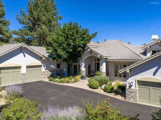 Discover this stunning custom-built home featuring a spacious 3-car garage and an inviting courtyard entrance.