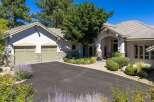 Discover this stunning home featuring a welcoming driveway leading to a charming entrance.