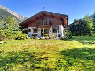 Charming alpine chalet nestled amidst breathtaking mountain scenery.