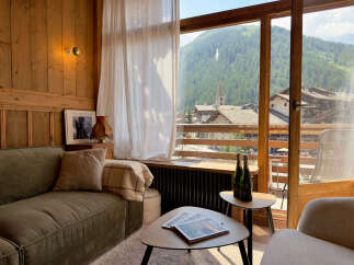 Experience breathtaking mountain views from this charming alpine retreat.
