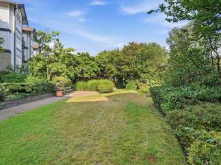 Enjoy the lush greenery and serene atmosphere of this property's outdoor space.
