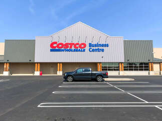 Discover a prime commercial property featuring the prominent Costco Business Centre signage, indicating a high-traffic retail or wholesale location.