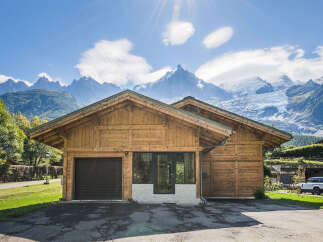 Experience the ultimate mountain retreat in this stunning wooden chalet, perfectly situated with breathtaking views of snow-capped peaks and glaciers.
