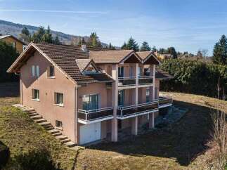 Discover this charming multi-level home featuring multiple balconies with scenic views, perfect for enjoying the outdoors.