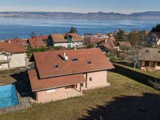 Experience breathtaking lake and mountain views from this stunning property.