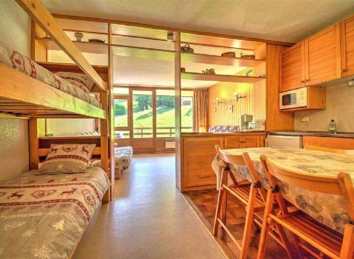 This charming studio apartment features a cozy bunk bed area, perfect for families or extra guests.