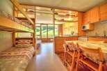 This charming studio apartment features a cozy bunk bed area, perfect for families or extra guests.
