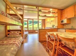This charming studio apartment features a cozy bunk bed area, perfect for families or extra guests.