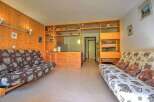 This cozy studio apartment features a versatile living space with two comfortable sofa beds, perfect for accommodating guests.