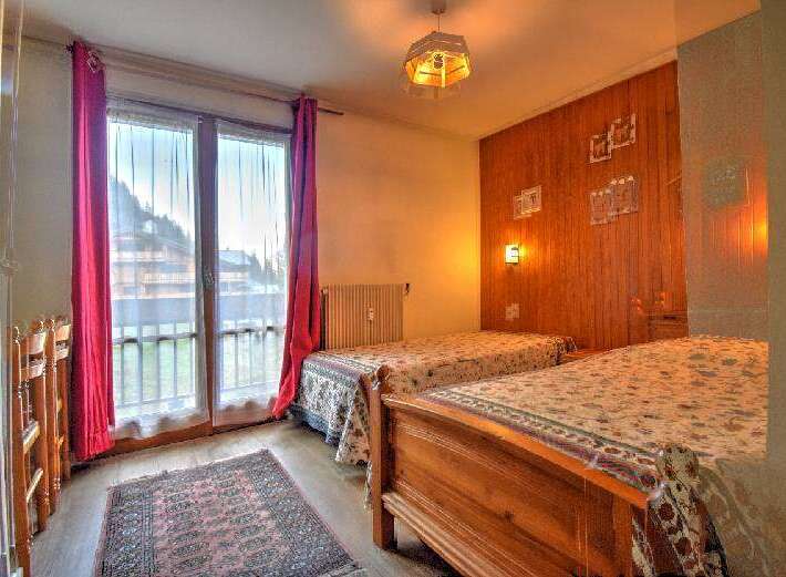 This charming bedroom features two comfortable twin beds, perfect for accommodating guests or family.