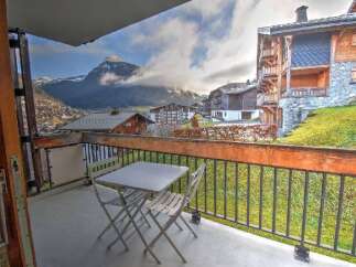 Enjoy breathtaking mountain views from this charming balcony, perfect for your morning coffee or evening relaxation.