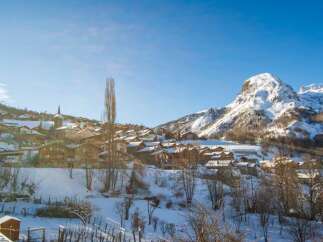 Experience the charm of alpine living in this picturesque village nestled amidst snow-capped mountains.