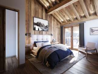 Experience rustic luxury in this charming mountain bedroom, featuring a cozy king-sized bed with plush navy bedding and a faux fur throw.
